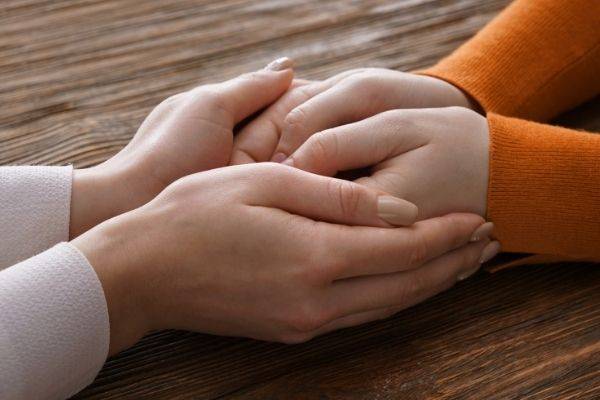 Friend Holding Hand And Comforting, Heartbreak Survival Guide