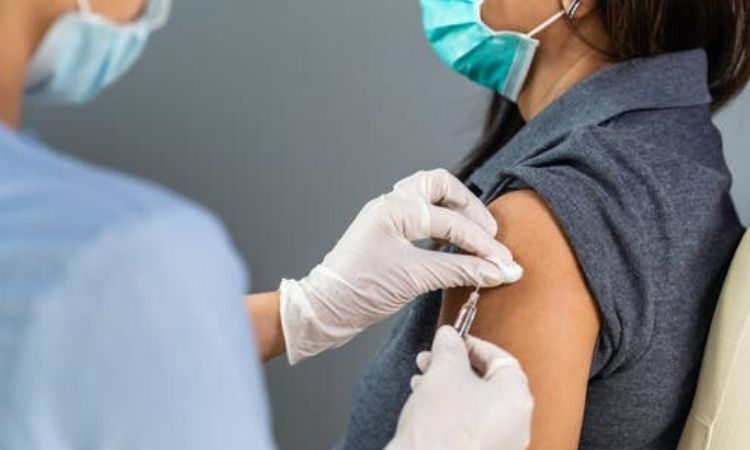 A woman getting vaccinated