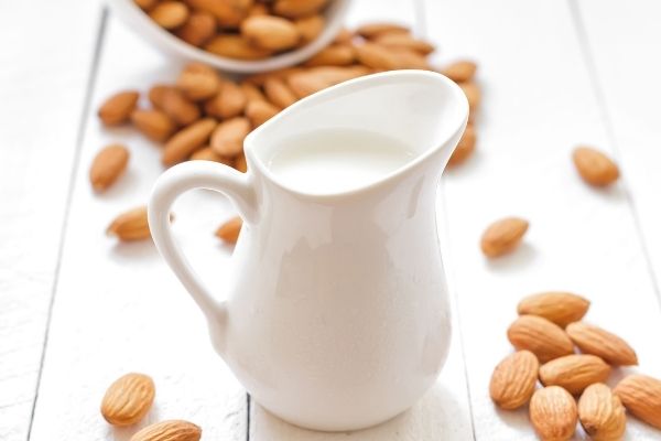 Vegan Milk Recipes: An image of almond milk in a white jug