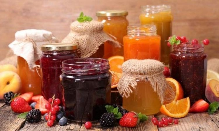 A set of assorted fruit jams kept together
